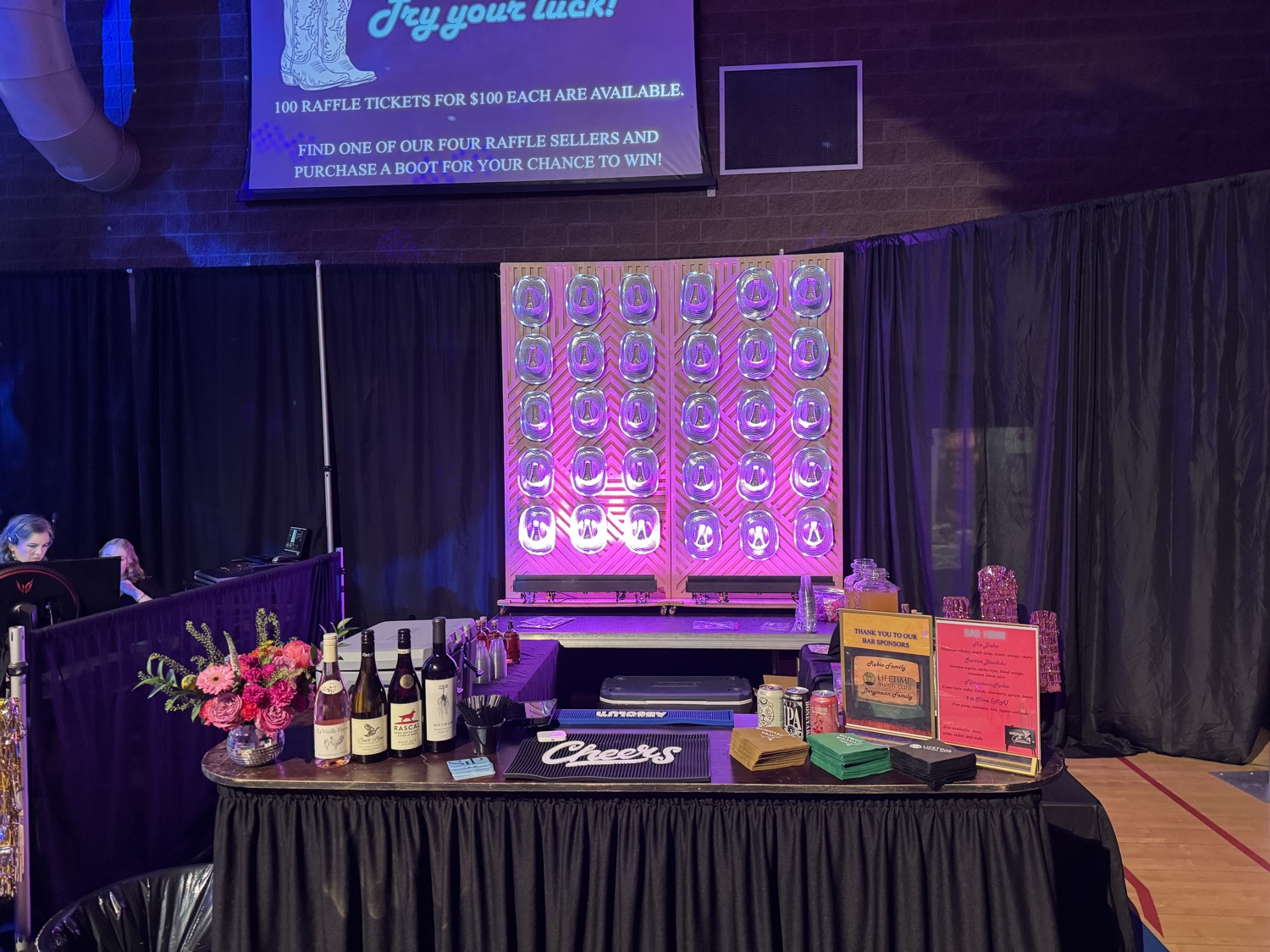 Fundraiser mobile bar catering with glowing bottle wall and Sips cocktail catering service