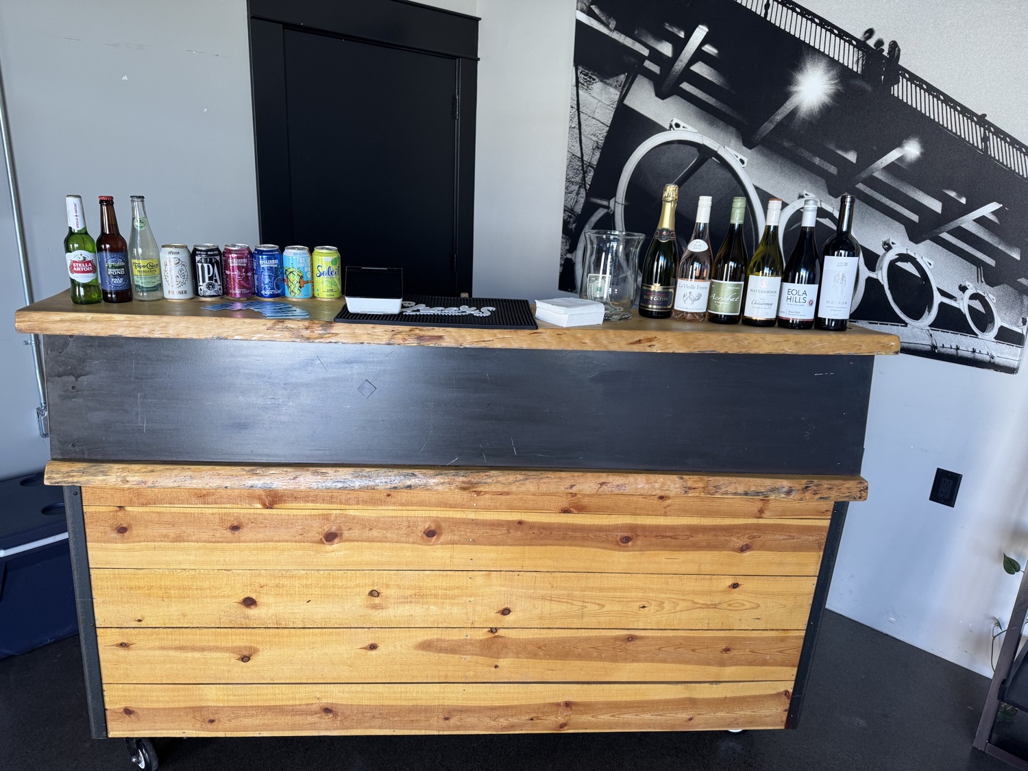 Wood mobile bar stocked with beer wine and event bartending supplies for Bend Oregon events